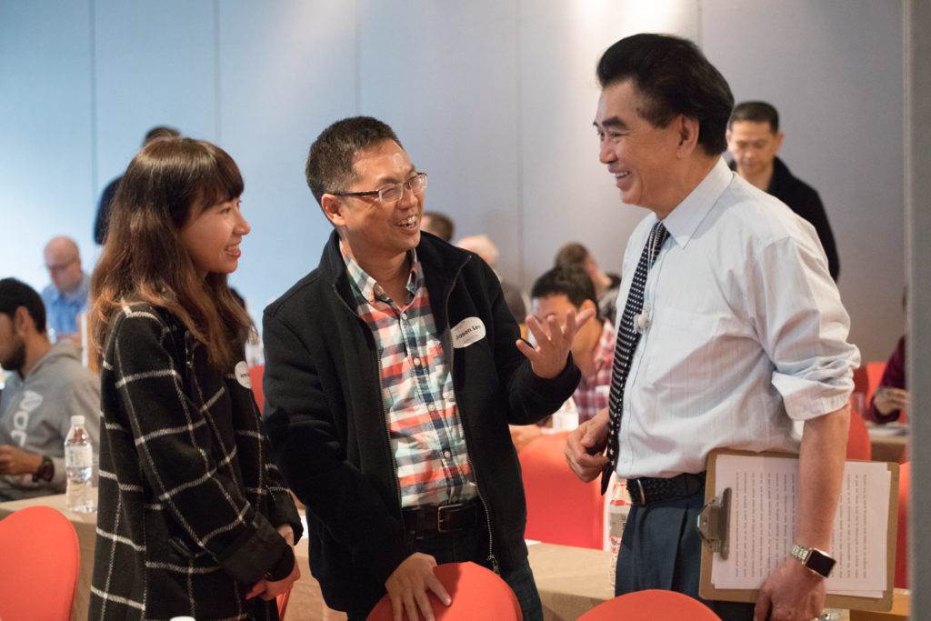 Dr David Hon (right) catches up with distributors